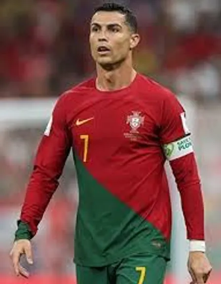 a soccer player in a red and green uniform make him look like a real Cristiano ronaldo