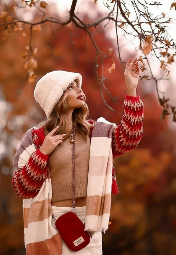 Woman in a Hat and Scarf Holding a Parasol, Holding a Cell Phone. have her holding a parasol instead of a cell phone