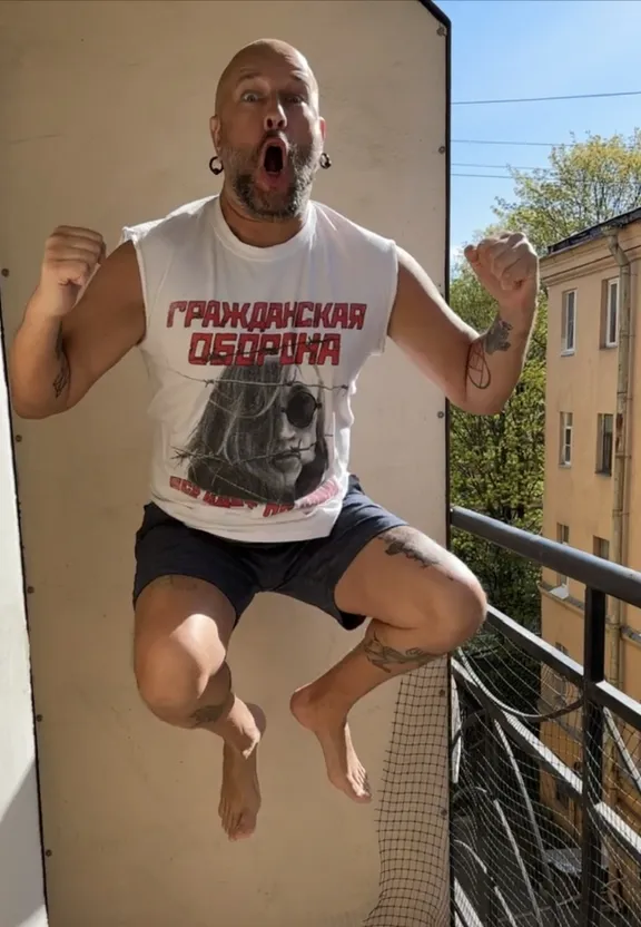 a man jumping in the air with his mouth open