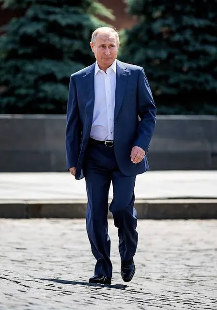 a man in a suit walking down a street make him look like a real Putin