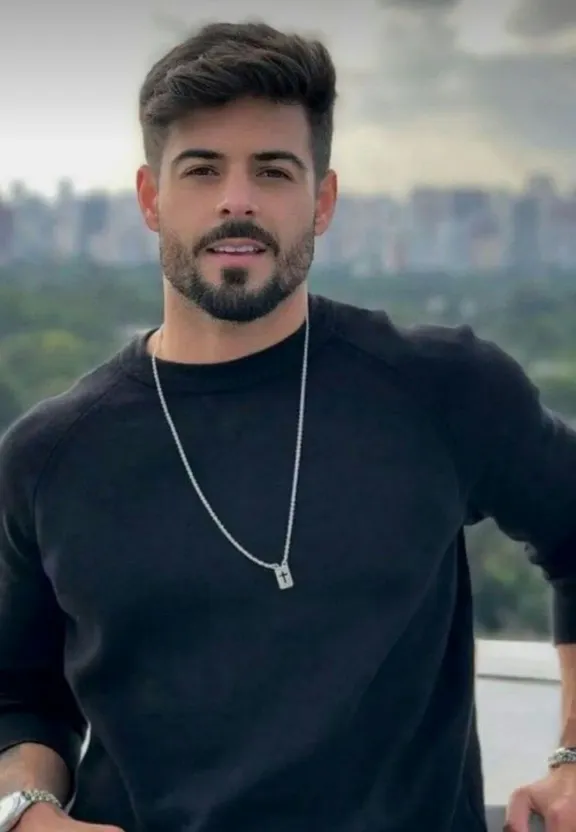 a man with a beard wearing a black shirt