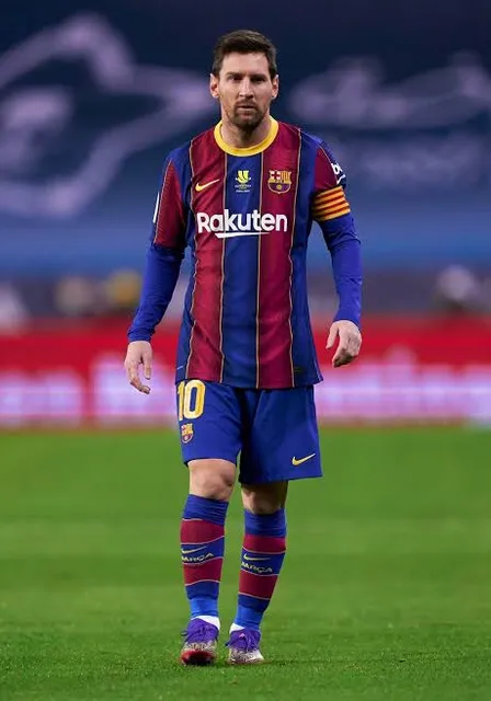 a man standing on top of a soccer field