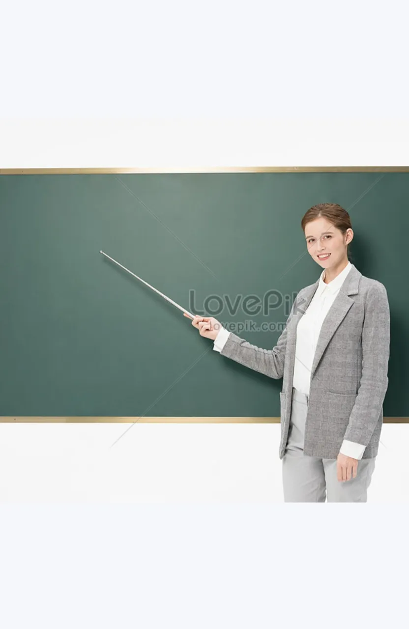 a woman teacher standing in front of a blackboard