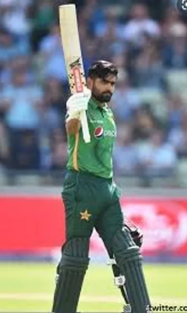 a man holding a cricket bat on a field