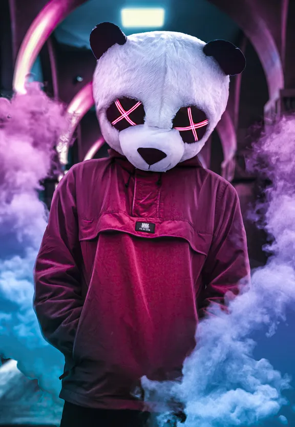 a person wearing a panda mask standing in smoke