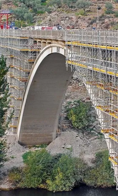 a large bridge with scaffolding on the side of it