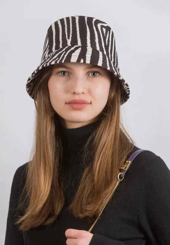 a woman wearing a zebra print hat