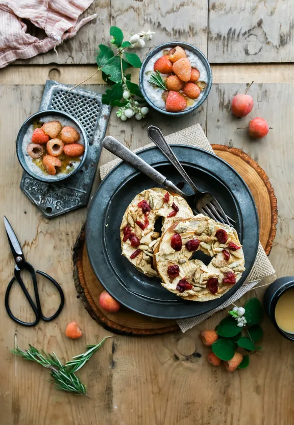 a table topped with plates of food and utensils