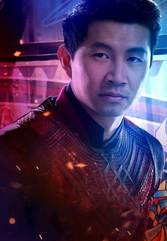 a man standing in front of a colorful background