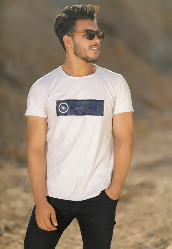 a man with dreadlocks wearing a white t - shirt