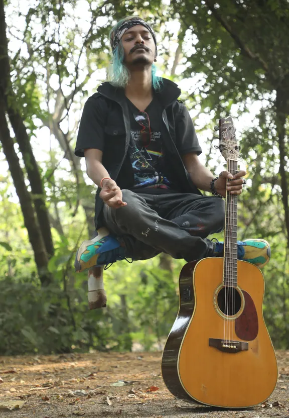 a man sitting on top of a wooden guitar with hair colors changing and his face left unchanged. hair colors changing and do not change the face