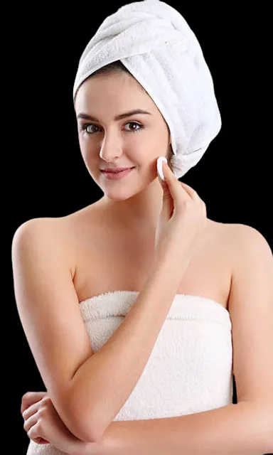 a woman with a towel wrapped around her head