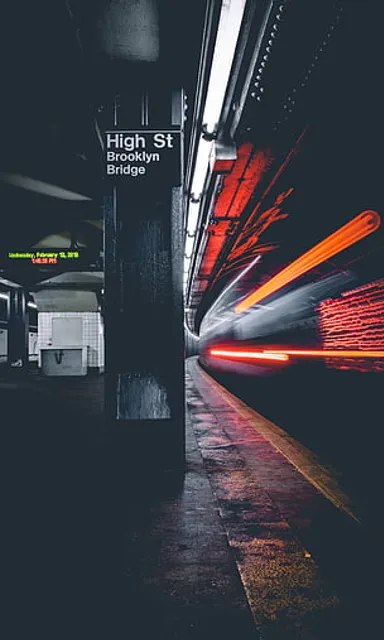 a long exposure photo of a subway station