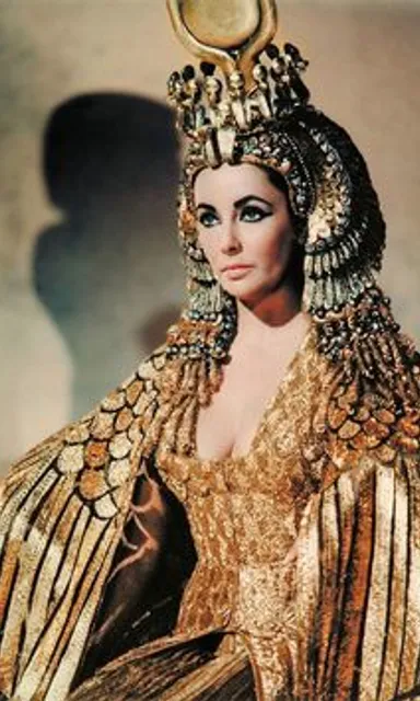 cleopatra dressed in a golden costume with beautiful eyes