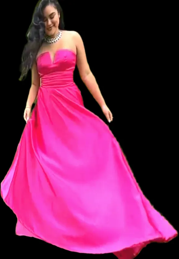 a woman in a pink dress is dancing