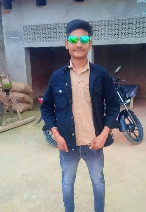 a man standing in front of a motorcycle