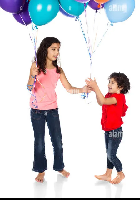 a little girl holding a bunch of balloons with her mother - stock image