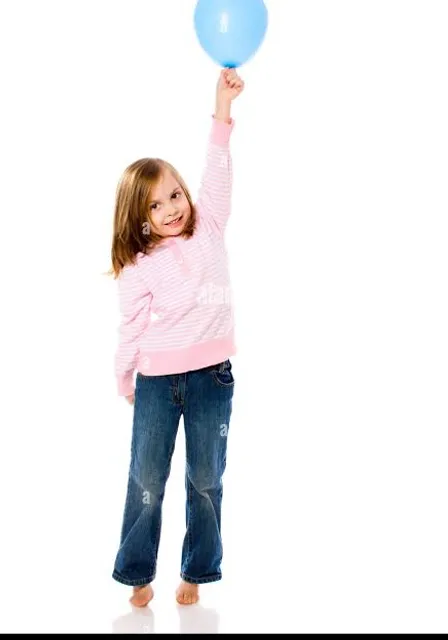 a little girl holding a blue balloon in the air