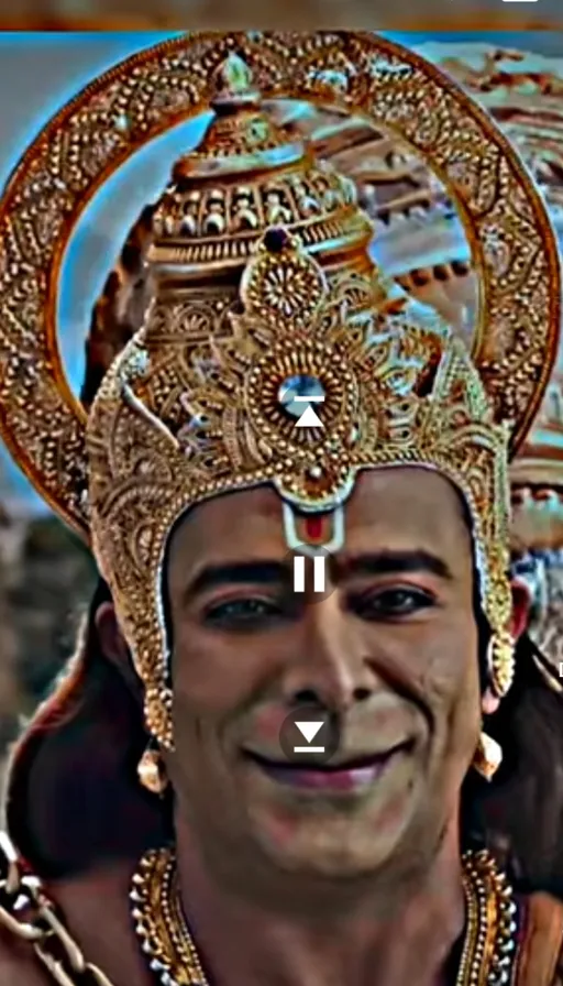 a man wearing a gold headdress with a smile on his face