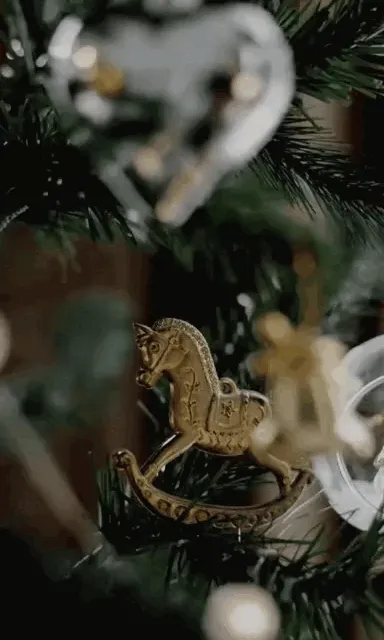 a close up of a christmas tree with ornaments