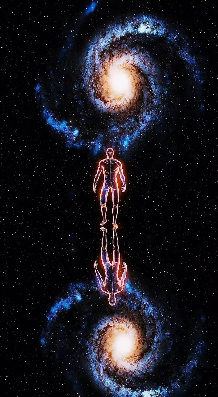 a man standing in front of two spiral galaxys