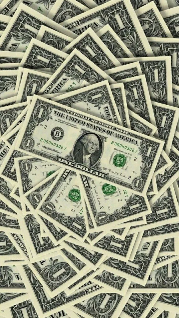 a pile of twenty dollar bills sitting on top of each other