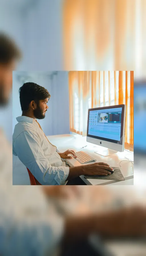 a man editing a paper using a typewriter. Change the computer to a typewriter