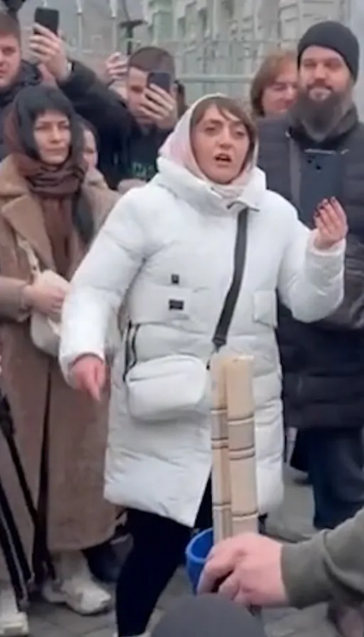 a group of people standing around each other