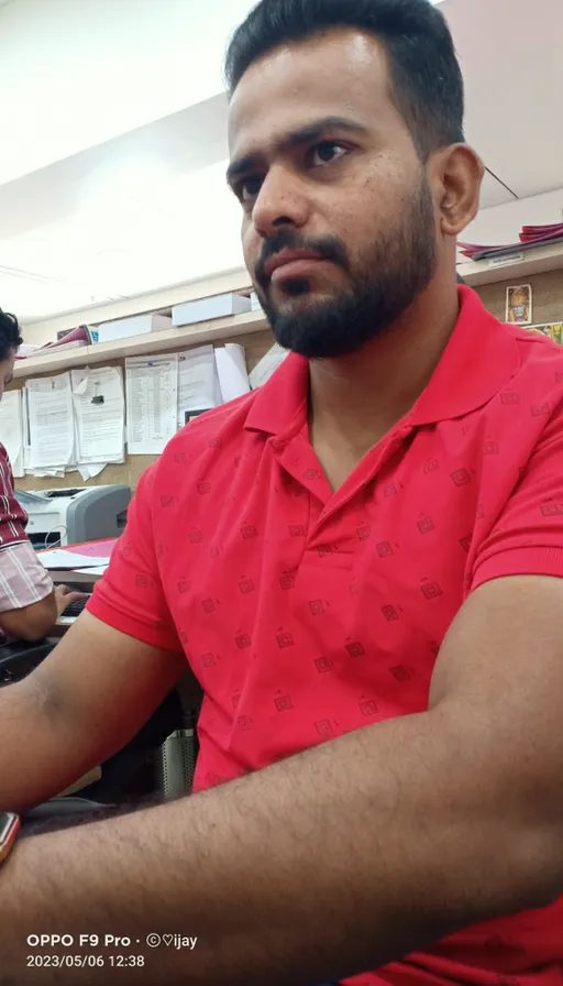 a man sitting in front of a laptop computer