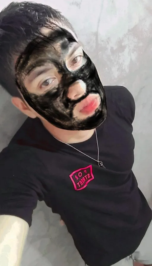 a man with a black mask on his face