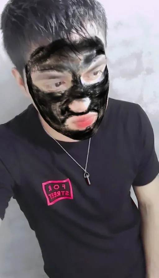 a man with a black mask on his face