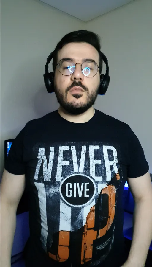 a man wearing headphones and a black shirt