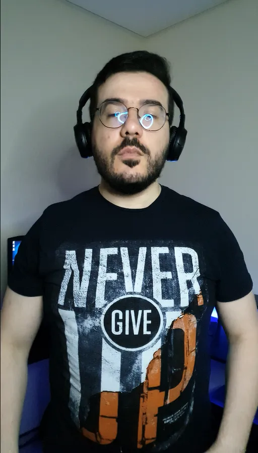 a man wearing headphones and a black shirt