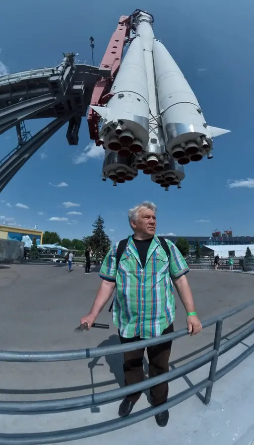 a man standing in front of a space shuttle