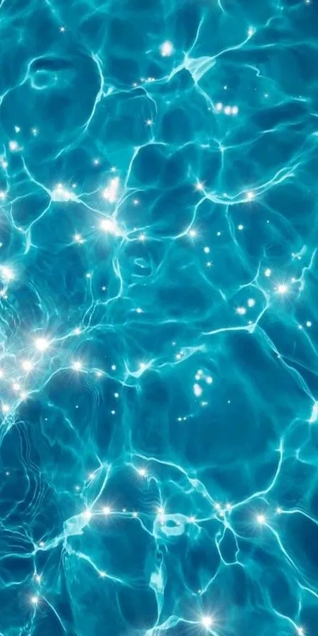 a pool with blue water and bubbles in it. water, liquid, nature, azure, fluid, organism, aqua, art, gas, pattern