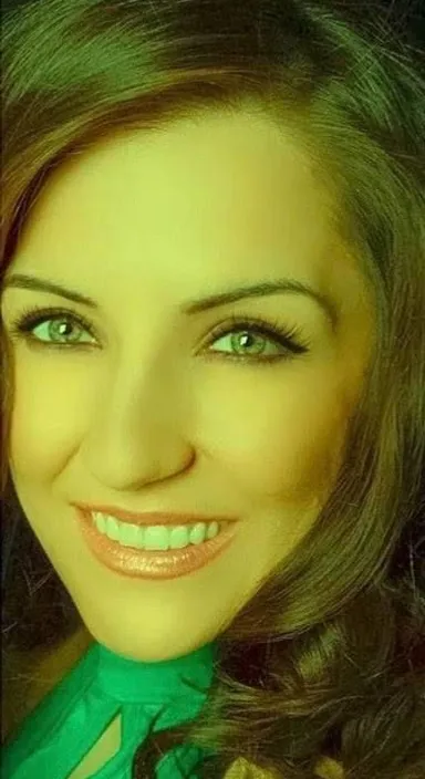a woman wearing a green shirt and a green tie