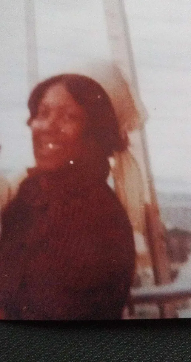 a polaroid picture of a black woman woman smiling