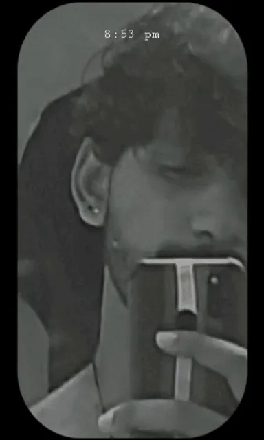 a man is taking a picture of himself with a camera