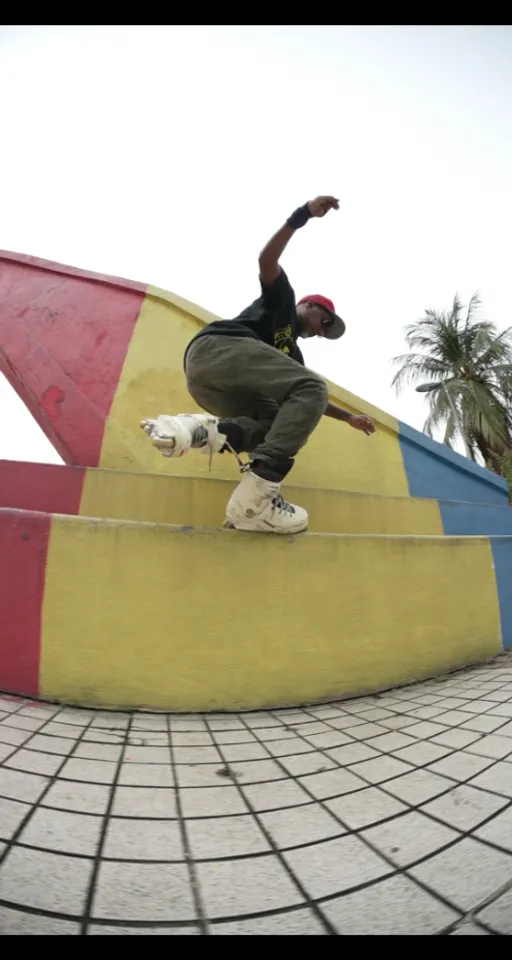 a man riding a skateboard up the side of a ramp