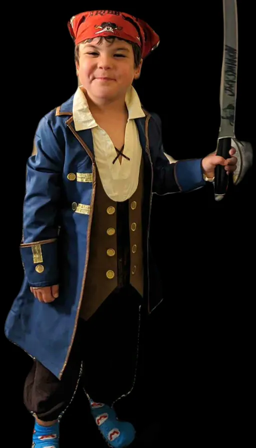 a young boy dressed in a pirate costume holding a sword