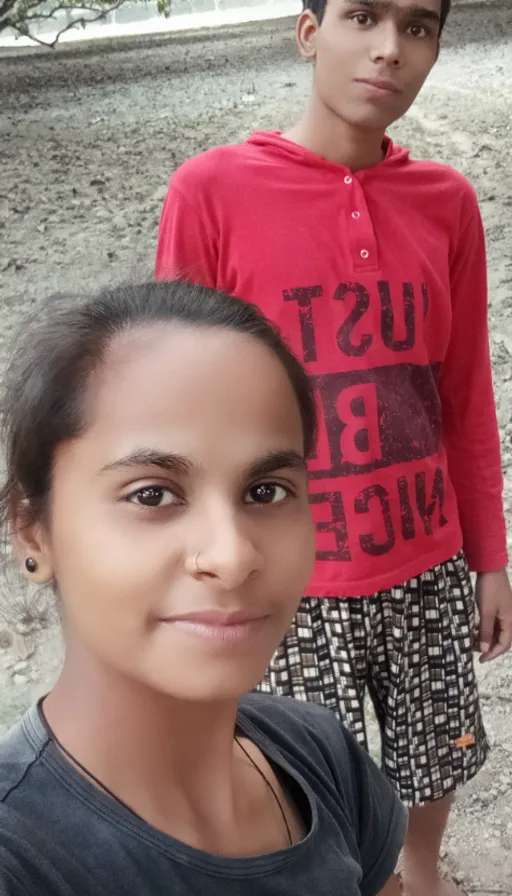 two young boys standing next to each other