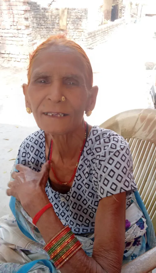 a woman sitting in a chair with a smile on her face