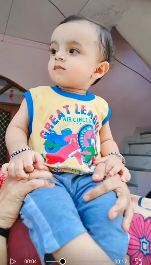 a woman holding a baby in her lap