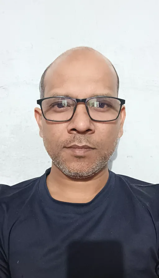 a man with glasses and a black shirt
