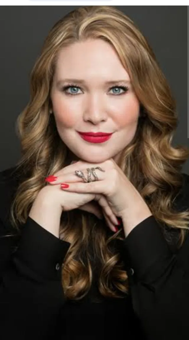 a woman with red nails and a black shirt