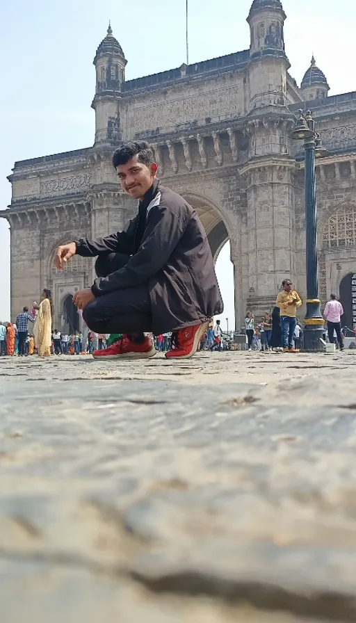 A man sitting on the ground in front of a building - view of the building through his transparent body. make the building transparent