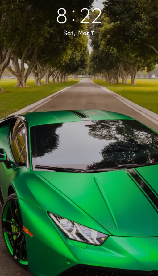 a green sports car parked on the side of a road