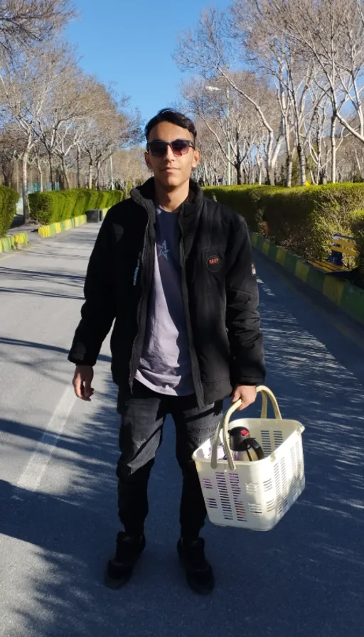 a man walking down a street carrying a basket