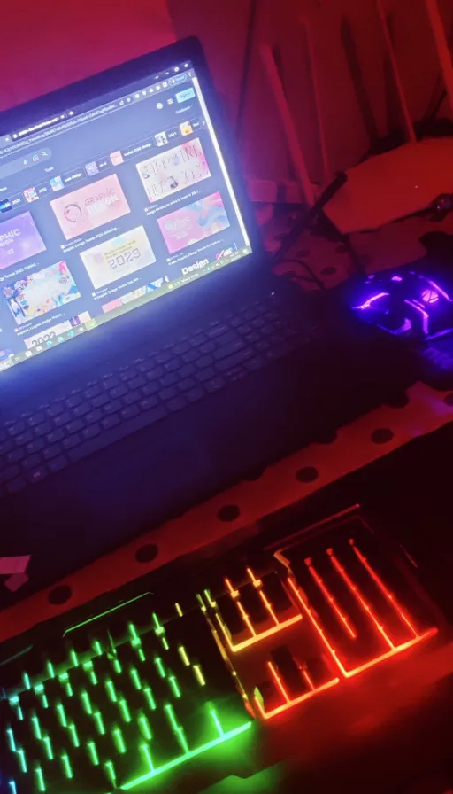 a laptop computer sitting on top of a desk