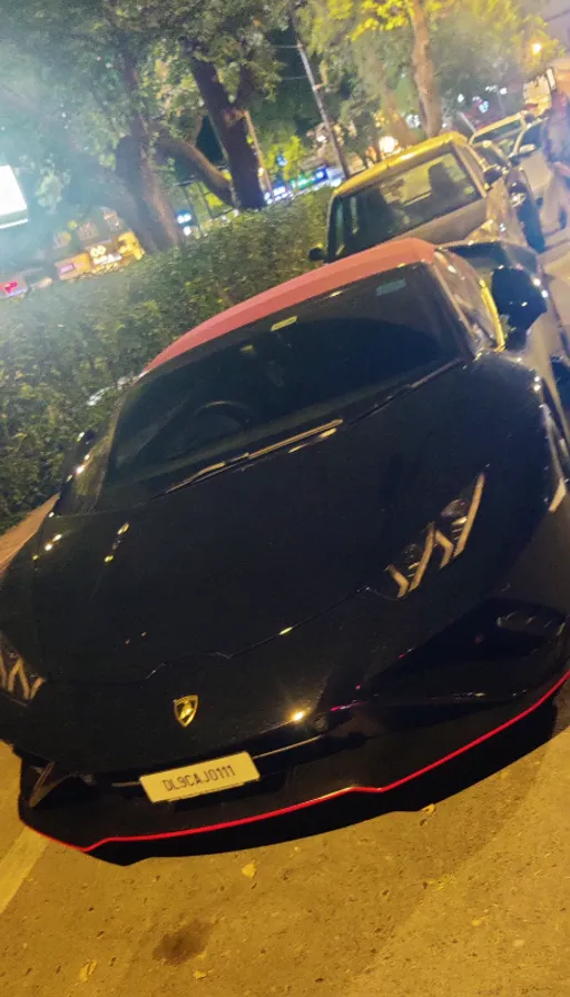 a black sports car parked on the side of the road